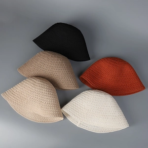 Group display of five colorful breathable hollow-knit bucket hats in various shades