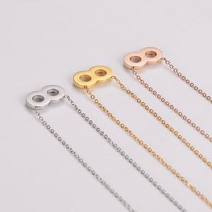 Three minimalist infinity necklaces in gold, silver, and rose gold with a polished finish