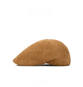 Side view of tan suede beret featuring vintage stitching details and a smooth matte finish