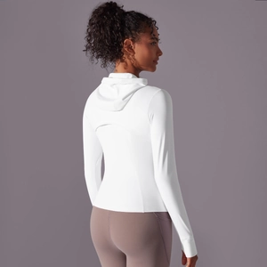 Detail of white hooded sports jacket with breathable back cutout for running and yoga