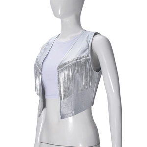 Detail of silver metallic PU vest with hanging fringe and textured surface finish