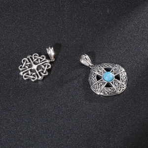 Vintage Celtic knot pendants in titanium steel featuring turquoise gemstone inlay