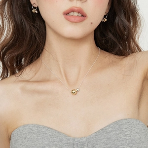 Minimalist 18k gold and silver ball pendant necklace with matching stud earrings