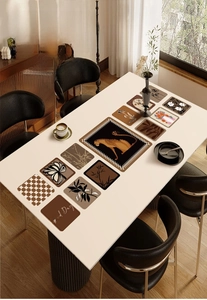 Detail of waterproof leather placemats featuring vintage leopard and floral prints