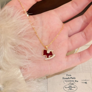 Exquisite 18K gold plated rocking horse necklace with red enamel and zircon accents