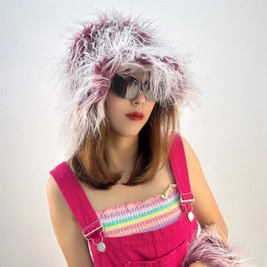 Close-up of pink and white faux sheepskin bucket hat with fluffy texture and fur detail