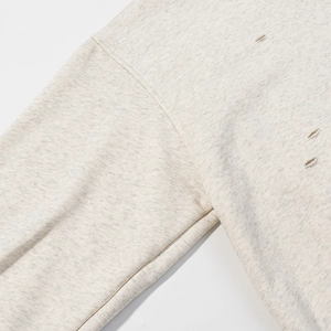 Light grey distressed hoodie with leopard print accents and long sleeves in knit fabric