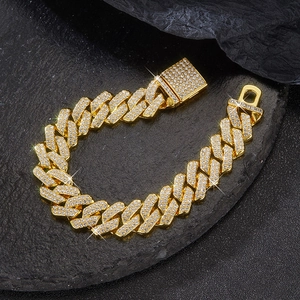 Macro shot of 14mm gold Cuban link chain with luxury iced out pavé set crystal diamonds