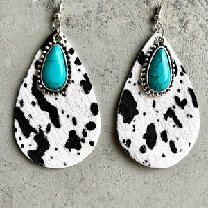 Western cow print teardrop leather earrings with turquoise stone in a minimalist style