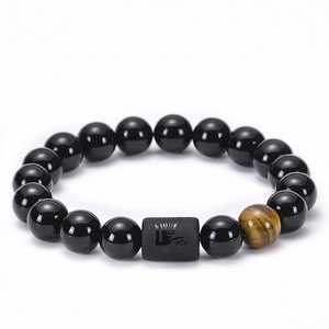 Macro detail of Virgo zodiac bead bracelet with black onyx and brown tiger eye stones