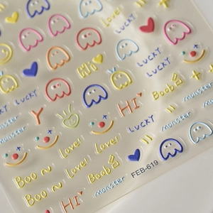 Detailed macro view of 3D embossed nail stickers featuring colorful cute bear patterns