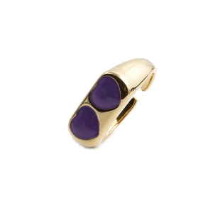 Polished gold open ring featuring double purple enamel heart accents on a white background