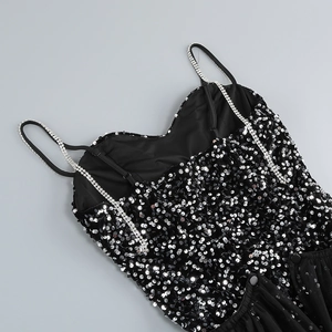 Close-up of black sequined evening dress with shimmering rhinestone spaghetti straps