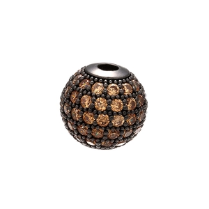 Macro shot of a gunmetal round bead paved with brown crystals for DIY jewelry making