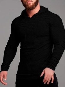 Detail of slim-fit men's black knit hoodie showing vertical ribbed texture and premium fabric