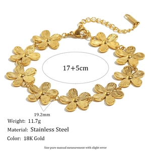 18K gold plated stainless steel daisy flower link chain bracelet for women on white background