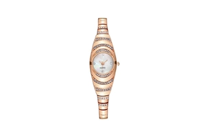 Macro shot of rose gold women's quartz watch with sparkling crystals and mother of pearl dial