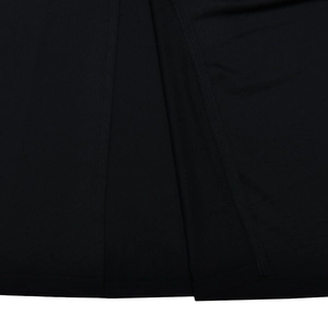 Close-up detail of the hem stitch and elegant side slit on this black slim dress