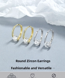 Macro detail of S925 hallmark on round zircon silver hoop earrings in gold and silver finish