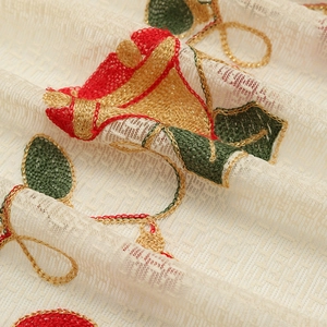 American Christmas tablecloth with bell embroidery and festive red and gold lace patterns