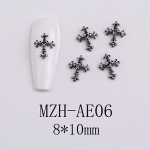 Macro detail of 8x10mm gunmetal gothic cross nail charms with embossed metal texture
