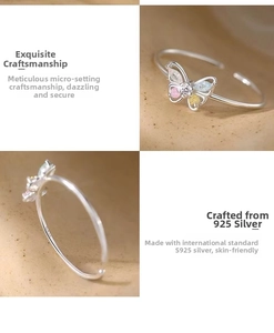 Macro detail of S925 sterling silver stamp and colorful zircon butterfly inlay on ring