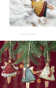 Detail of painted metal Christmas angel ornaments with festive patterns and textures