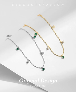 Detail of S925 sterling silver beaded bracelets with emerald pendants and square crystals