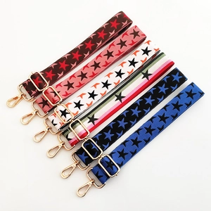 Detail of adjustable thick shoulder straps with colorful star patterns and gold metal hooks
