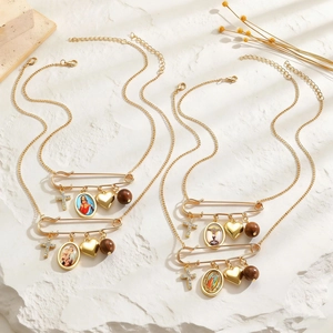 Vintage gold layered necklace set with cross, Maria medal, heart and pin pendants
