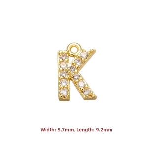 Macro detail of gold plated letter K pendant with micro-paved cubic zirconia 9.2x5.7mm