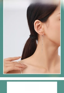 Long S925 sterling silver tassel chain earrings with triple beads on an Asian model