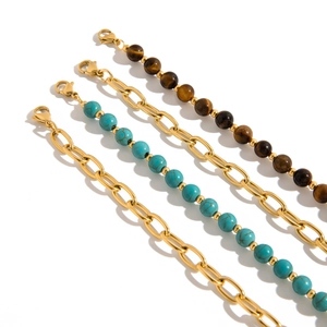 Stainless steel bracelet set with turquoise and tiger eye beads in gold finish