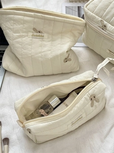 Quilted cream vanity bag with cute rabbit embroidery and large interior capacity