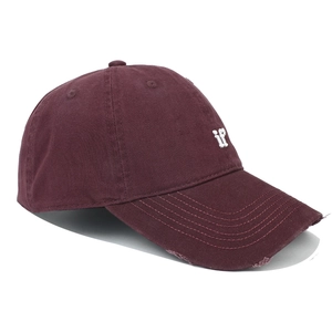 Detail of burgundy baseball cap featuring white 'if' embroidery and distressed brim texture