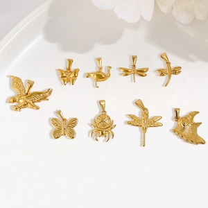 Detailed view of 24K gold plated animal pendants including butterfly, duck and eagle