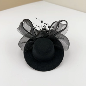 Elegant black mini top hat with mesh veil and bow for vintage formal party hair styling
