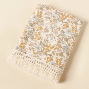 Floral double gauze baby blanket with tassel fringe edge in cream cotton fabric