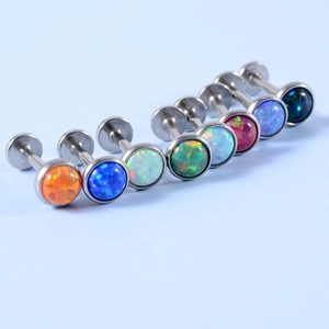 Macro shot of colorful opal labret studs with stainless steel threaded flat back posts