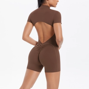 Detail of the backless cutout design and scrunch butt seam on a brown sports bodysuit