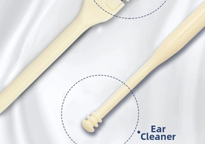 Detail of a portable double-ended ear cleaner with a spiral head on white silk