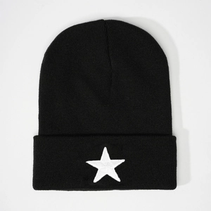 Classic black knitted beanie with white embroidered five-pointed star on the cuff