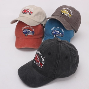 Detailed stack of five vintage baseball caps with motor club car embroidery