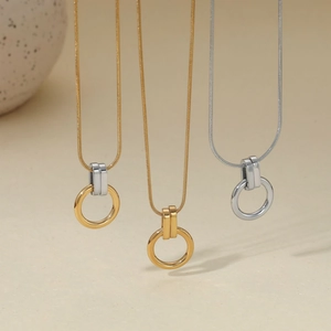 Minimalist stainless steel snake chain necklaces with circular pendants in gold and silver