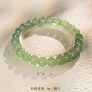 Elegant beaded jade chalcedony bracelet featuring translucent light green round stones