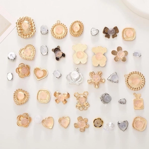 DIY metal shoe charms collection with gold and silver flowers, hearts, and pearls