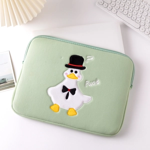 Detail of cute duck embroidery on soft green laptop sleeve with protective padding