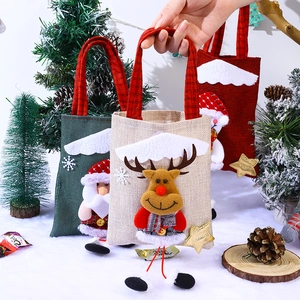 Detailed close-up of Christmas linen gift bags with festive 3D plush doll characters