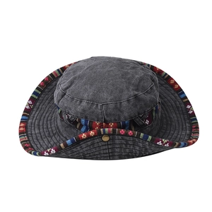 Macro view of washed canvas texture and ethnic woven band on a grey sun hat