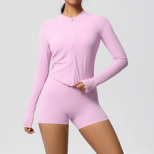 Detail of lavender yoga set featuring long sleeve zip jacket and high waist shorts